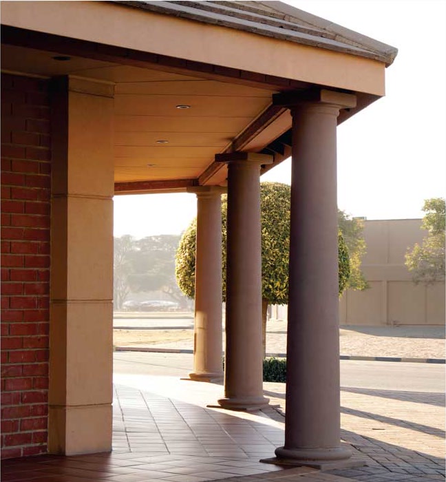 The covered colonnade walkway running along the front of the Welkom office.